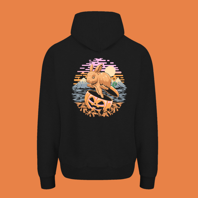 Black hoodie with a pumpkin design on the chest and a beach scene with a horse on the back, on a white background.